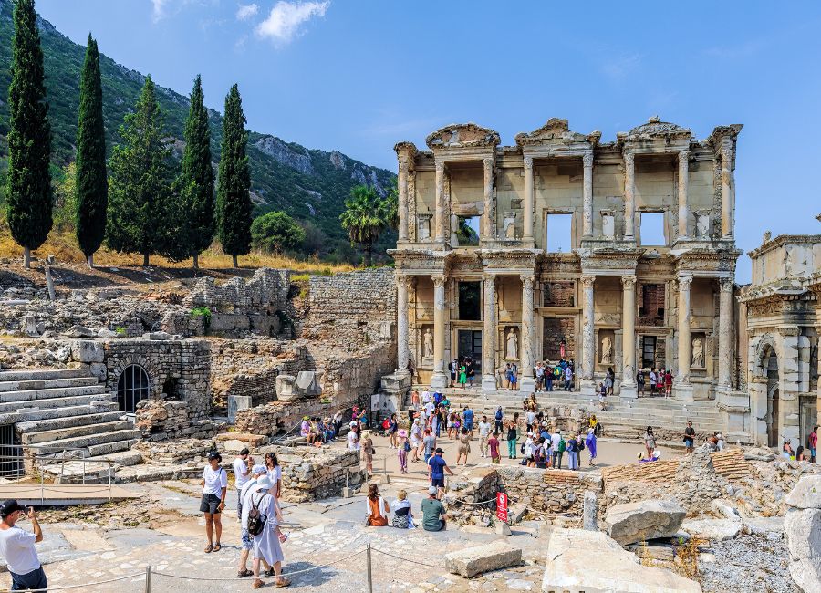 Tourists exploring the ancient ruins of Ephesus in Turkey during spring