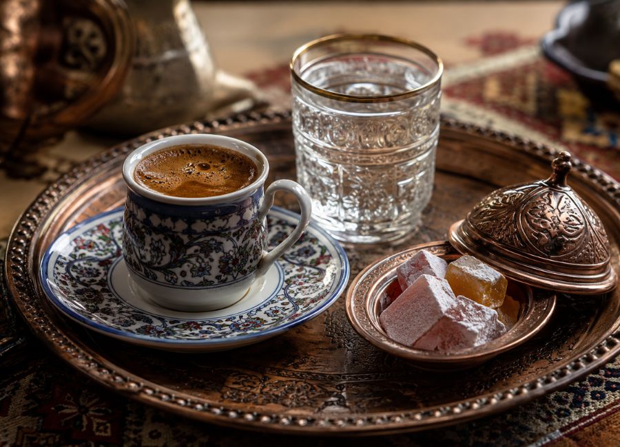 Traditional Turkish coffee serving etiquette with decorative cups and tray