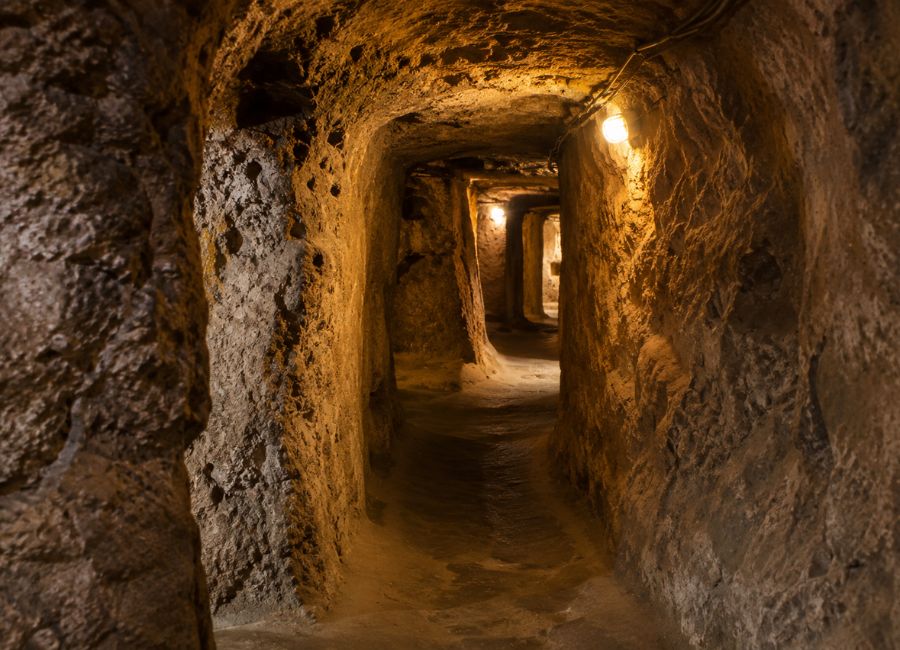 Narrow stone tunnel inside an underground city in Cappadocia