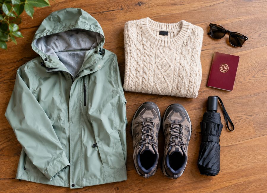 Winter packing list for Antalya with a rain jacket, sweater, walking shoes and umbrella
